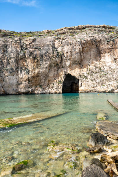 istock sea cave entrance in Gozo-Malta 1325088032