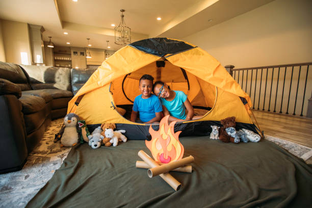 istock A Brother and Sister Camping in their Home 1325088372