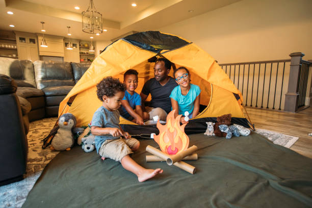 istock Young Father Camping in Home with Children 1325088925