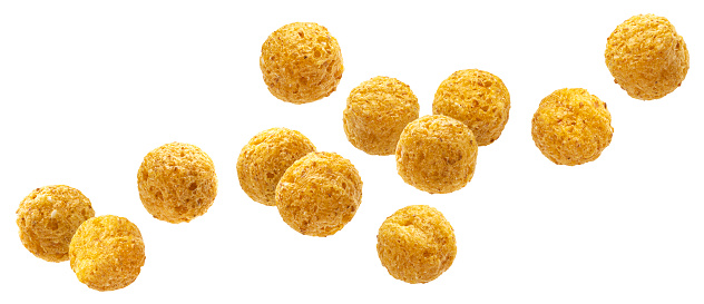 Falling corn balls isolated on white background with clipping path