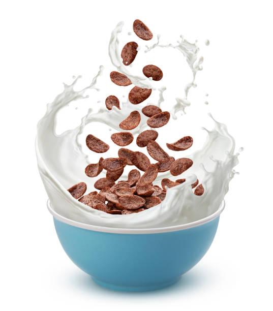 istock Chocolate corn flakes with milk splash isolated on white background 1325090760