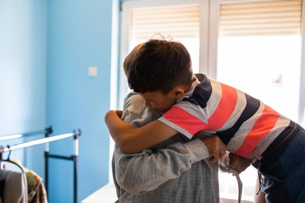 istock A young boy hugging an old woman 1325091499