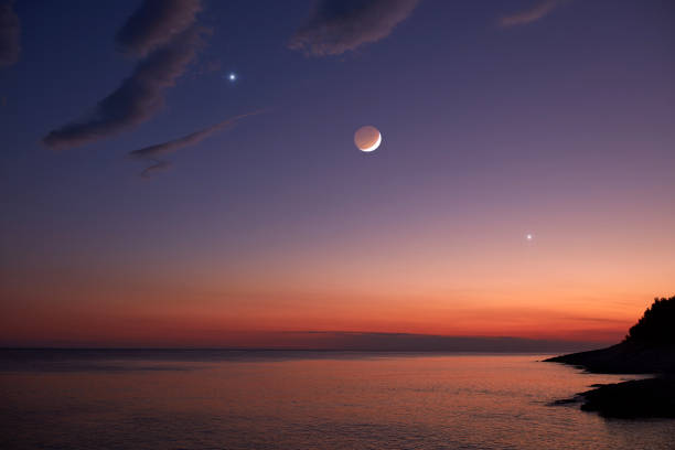 istock Moon and stars over sea ocean horizon. 1325092882
