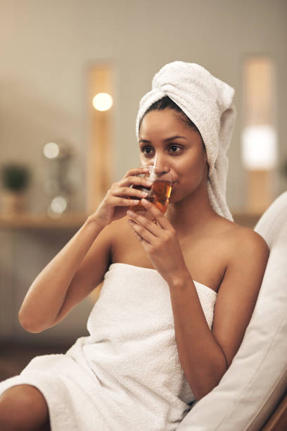istock Shot of a woman drinking tea while enjoying a spa day 1325095159