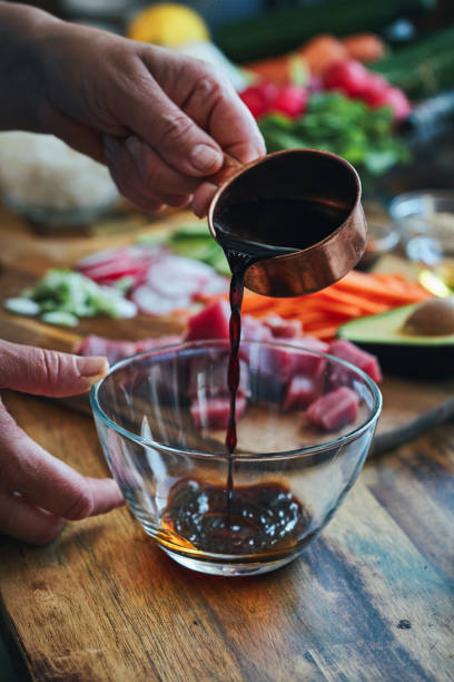 istock Preparing Ahi Tuna with Cucumber, Radish, Carrots and Avocado 1325095191