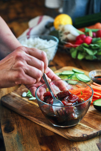 istock Preparing Ahi Tuna with Cucumber, Radish, Carrots and Avocado 1325095241