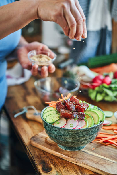 istock Preparing Ahi Tuna with Cucumber, Radish, Carrots and Avocado 1325095974