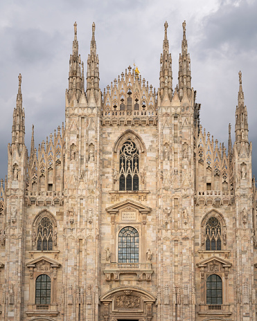 Front view of Duomo with the golden statue name \