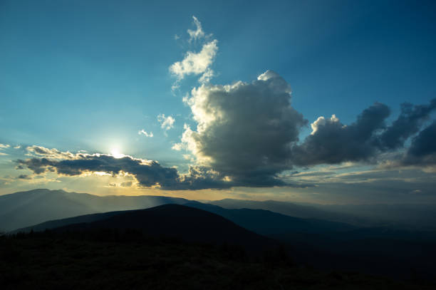 istock Sun rays and beautiful sky at sunset in the Carpathian mountains 1325098150