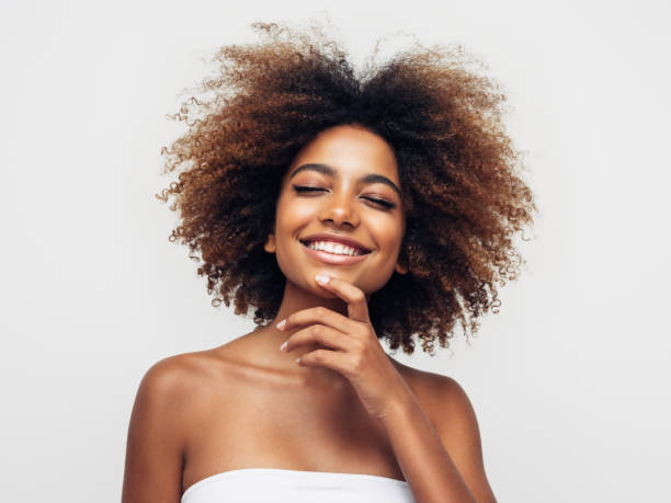 istock Beautiful smiling girl with curly hairstyle 1325100768