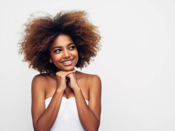 istock Beautiful smiling girl with curly hairstyle 1325100967
