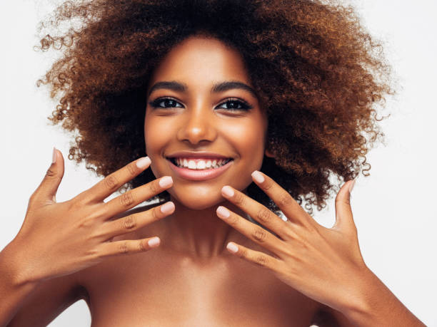 istock Beautiful smiling girl with curly hairstyle 1325101149