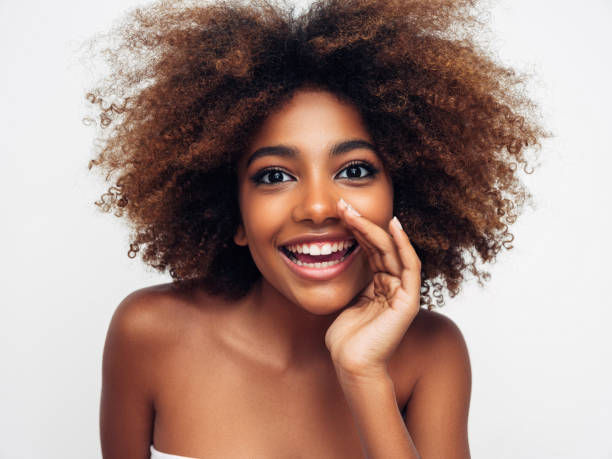 istock Beautiful smiling girl with curly hairstyle 1325101178