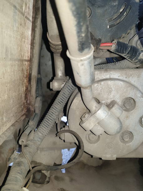 istock old car air conditioner compressor in the engine compartment against the background of an old radiator, repair and replacement of car spare parts 1325101270