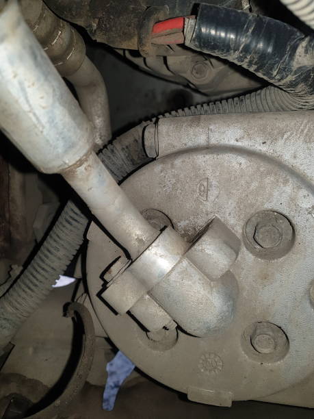 istock old car air conditioner compressor in the engine compartment against the background of an old radiator, repair and replacement of car spare parts 1325101304