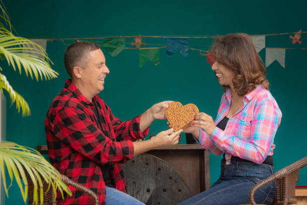 couple holding heart peanuts