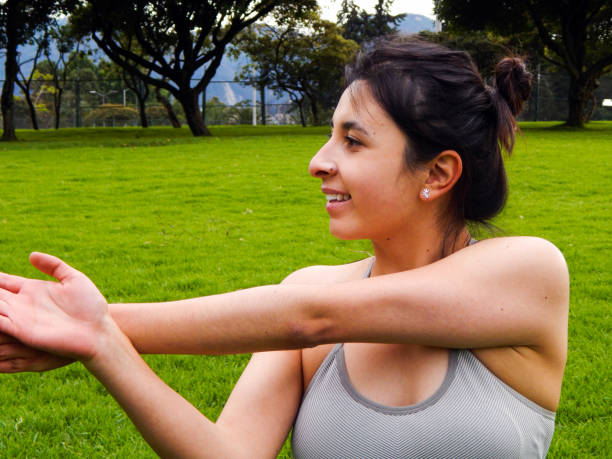 istock Woman exercising in the park 1325106354