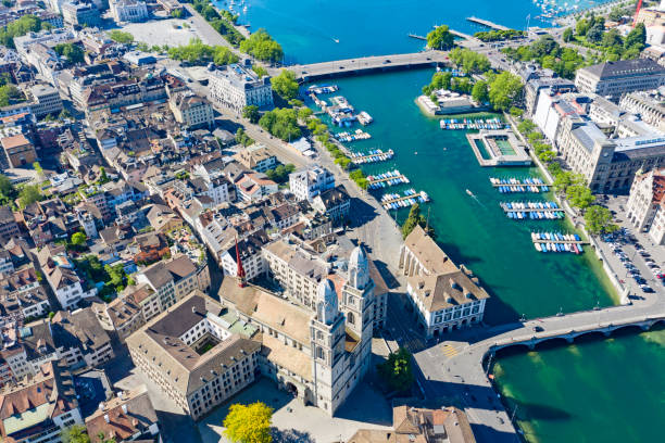 Zurich in summer Aerial view of Limmat river and famous Zurich churches. Zurich is important financial center of Switzerland and lovely historical city. switzerland zurich architecture church stock pictures, royalty-free photos & images