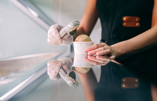 close up of scooping ice cream in gelato cafe