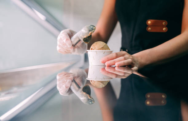 close up of scooping ice cream in gelato cafe close up of scooping ice cream in gelato cafe scoop shape stock pictures, royalty-free photos & images