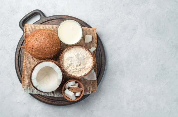 istock Coconut milk, flour and coconut on a gray background 1325112099