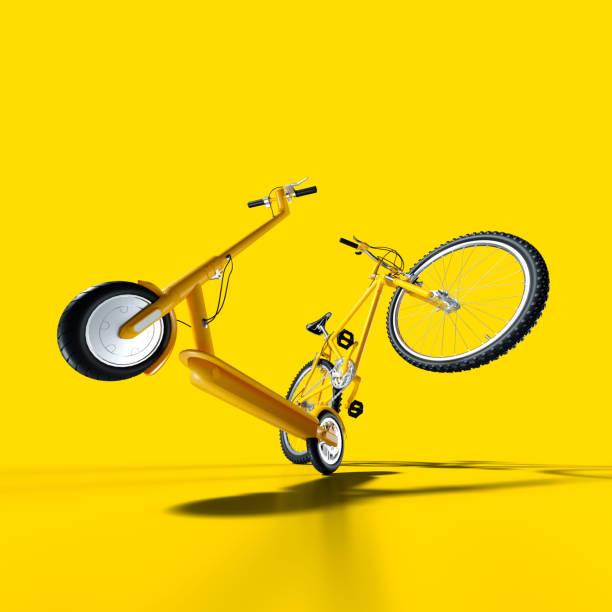 bicicleta de montaña y scooter de empuje eléctrico sobre fondo amarillo - neumático and foto de estudio and nadie fotografías e imágenes de stock