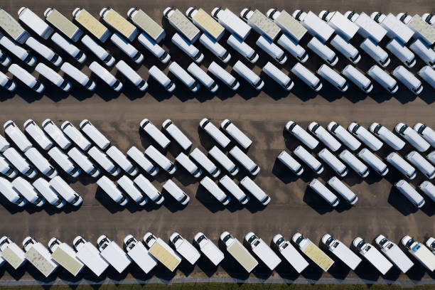 istock Aerial View of White Delivery Vans 1325116514