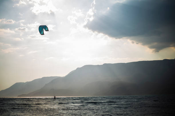 istock kitesurfing against sunset, Akyaka, Turkey 1325117644