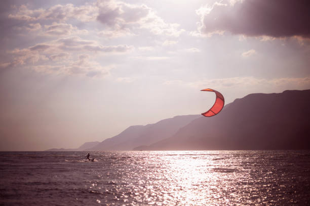 istock kitesurfing against sunset, Akyaka, Turkey 1325117666