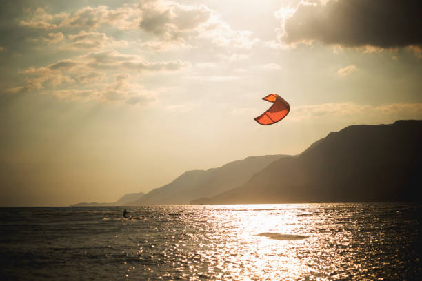 istock kitesurfing against sunset, Akyaka, Turkey 1325117691