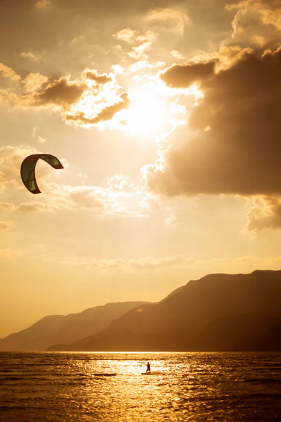istock kitesurfing against sunset, Akyaka, Turkey 1325117715