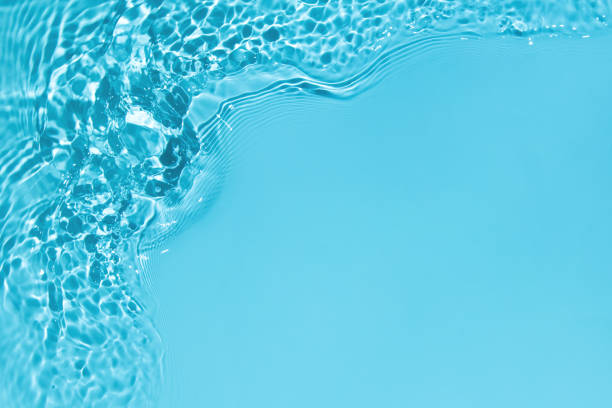 istock transparent blue colored clear calm water surface texture 1325118686