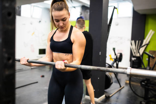 istock A young woman working out with weights 1325121025