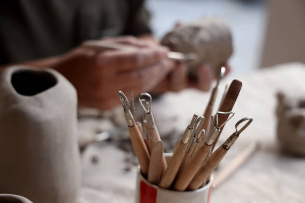 close up potter artist working on clay pottery sculpture fine art in thailand