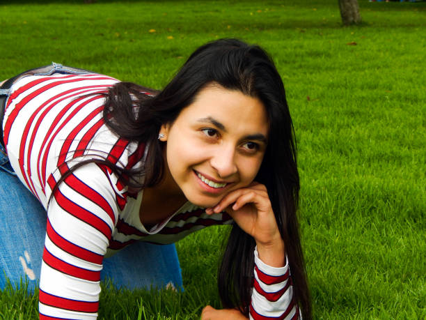 istock Woman posing in public park 1325122161
