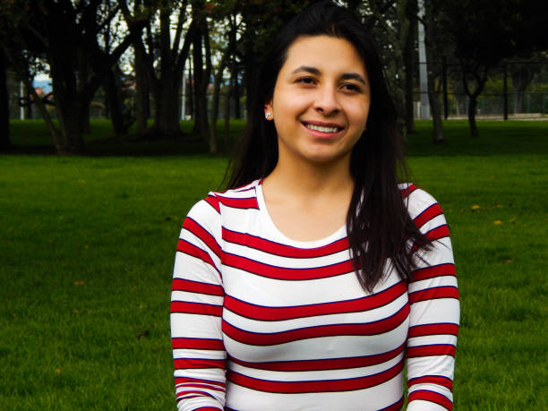 istock Woman posing in public park 1325122162