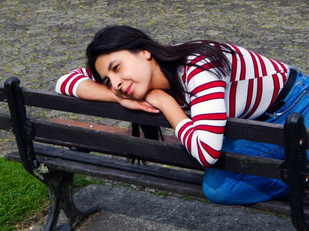 istock Woman posing in public park 1325122299