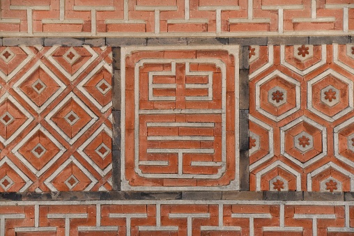 The pattern of the brick wall of the royal palace