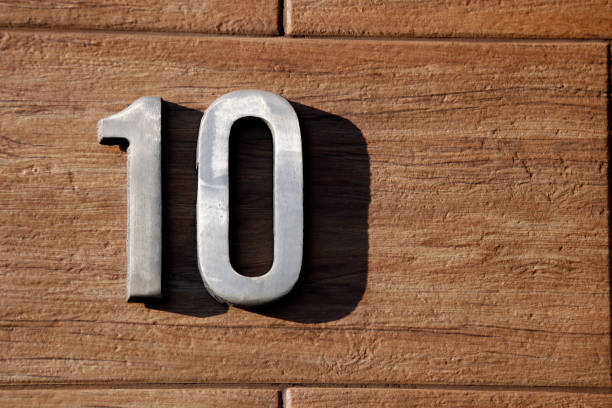 "10" metal number with spare and copy space number ten in metal material with shadow, fixed in texture and copy space - 10 number 10 photos stock pictures, royalty-free photos & images