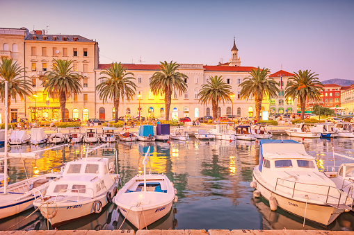 People enjoy the evening on the downtown waterfront in Split, Croatia.