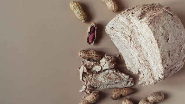 istock Peanut halva with nuts on a dark wooden background top view. Halva oriental sweets 1325141250