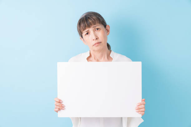 istock senior age woman having a white board, think, 1325144336