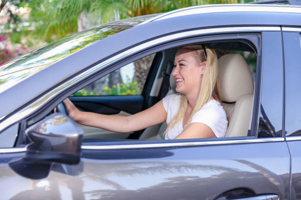 istock Young woman in drivers seat 1325145218