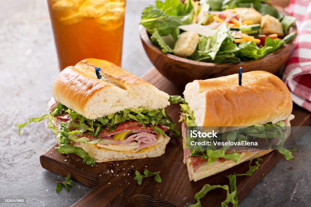 Italian sandwich for lunch Italian meat sandwich with salad and chips for lunch Sandwich Stock Photo