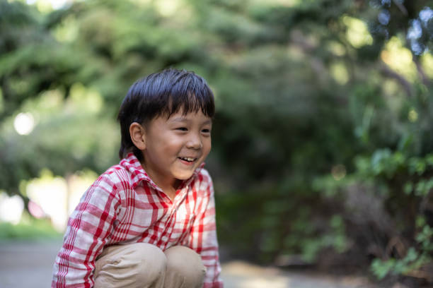 istock Asian boys playing in the park 1325148877