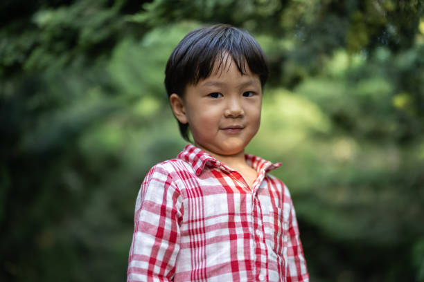 istock Asian boys playing in the park 1325148884