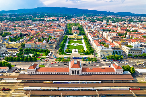 Zagreb central train station and Lenuci Horseshoe. Green zone of Zagreb historic city center aerial view, famous landmarks of capital of Croatia