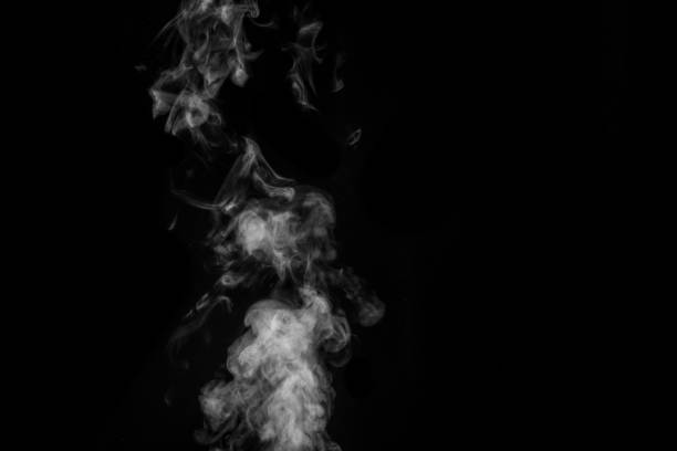 istock White smoke on black background. Figured smoke on a dark background. Abstract background, design element 1325156726