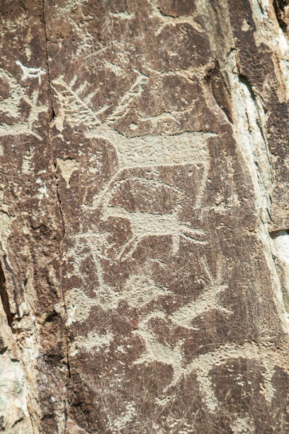 istock Petroglyphs, ancient rock paintings in Altai. Siberia 1325157680