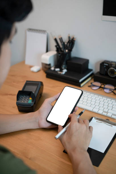 istock Man sitting at office desk and using mobile phone. 1325158519